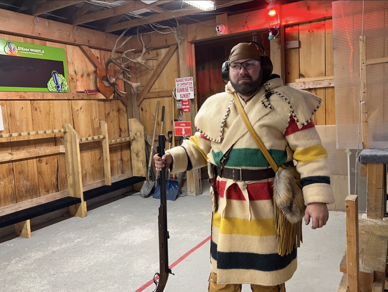 Wolfmaan wearing a Hudson's Bay Coat and Hawken style rifle